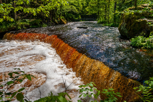Amber waterfall. Nommeveski cascade on the river Valgejogi in Lahemaa National Park, Estonia ( Nõmmeveski, Valgejõgi.) Landscape on a spring sunny day. Panorama. photo