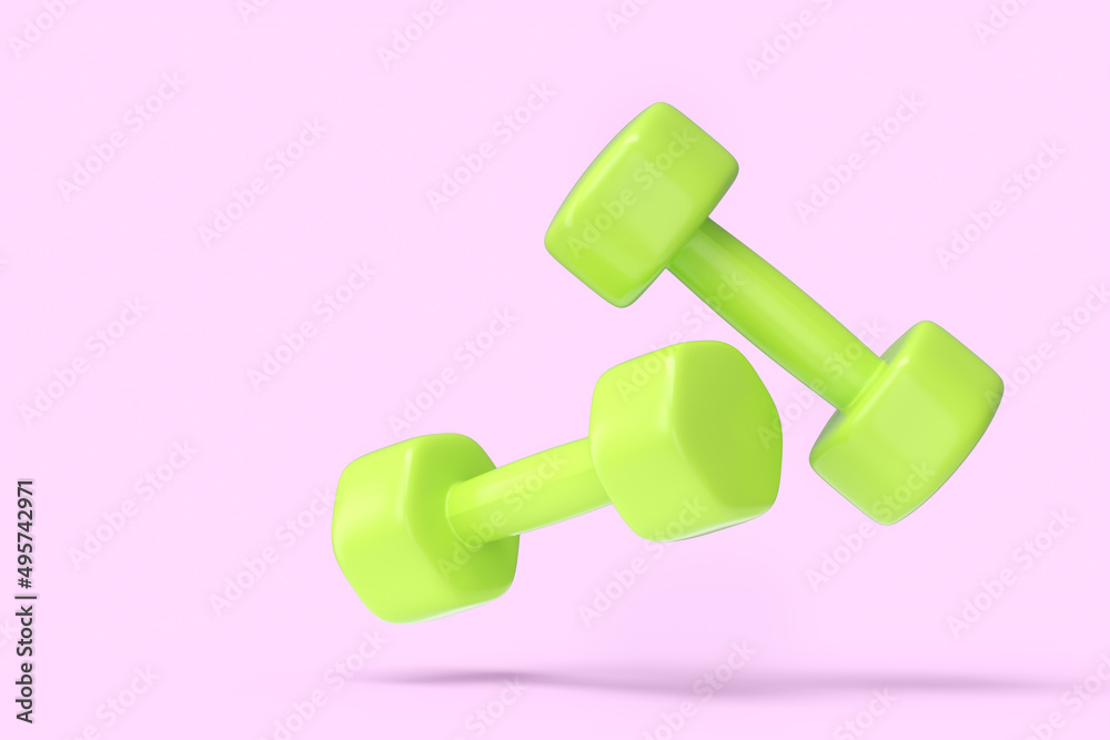 Pair of rubber green dumbbells isolated on pink background Pair of rubber green dumbbells isolated on pink background