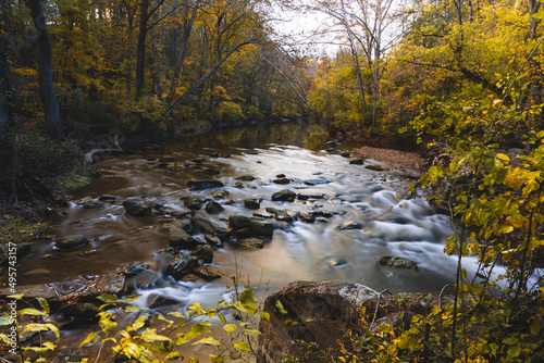 Scenic view of a river flowing in the forest in White Clay Creek State Park, Newark, Delaware photo