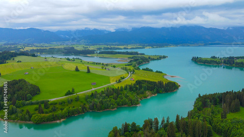 Aerial view over Lake Forggensee at the city of Fuessen in Bavaria Germany © 4kclips
