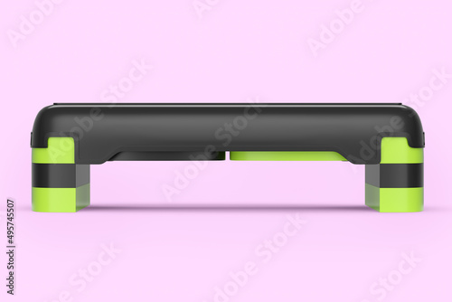 Stepper for fitness and green step platform for aerobics isolated on pink