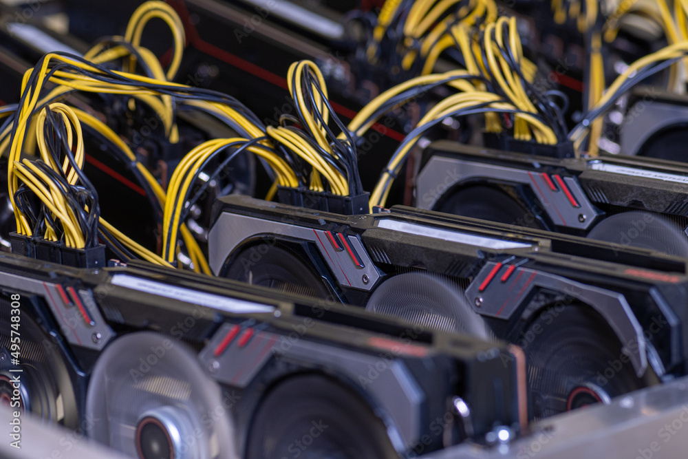 Mining cryptocurrency rig on video cards close-up.