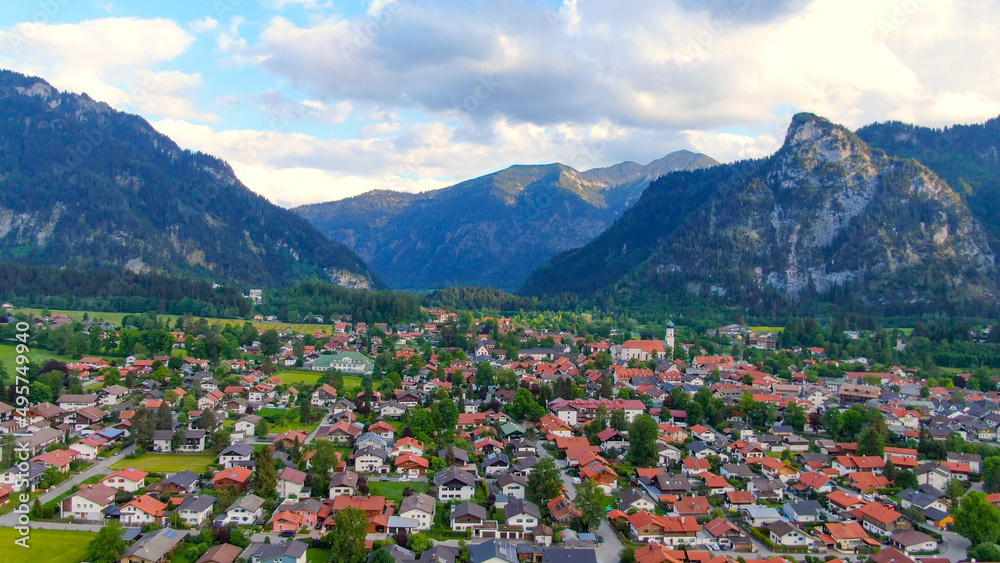 Foto Stock Aerial view over the city of Oberammergau in Bavaria Germany.  High quality 4k drone footage | Adobe Stock