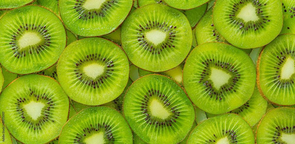 Kiwi Macro,Fresh Kiwi fruit sliced use for background,slice of kiwi fruit on a full frame. horizontal format Kiwi Macro,Fresh Kiwi fruit sliced use for background,slice of kiwi fruit on a full frame. horizontal format