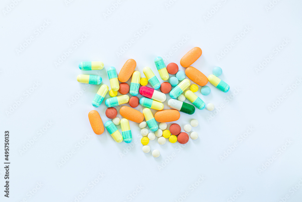 pills on a white background,Stack of different pills isolated on white background, pills on a white background,Stack of different pills isolated on white background,