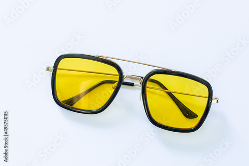 yellow fashion glasses on a white background,Circle yellow vintage glasses isolated on white background,Pair of modern, stylish sunglasses isolated on white.