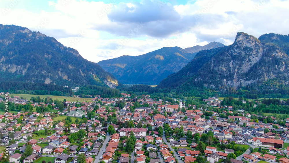 Aerial view over the city of Oberammergau in Bavaria Germany. High quality 4k drone footage
