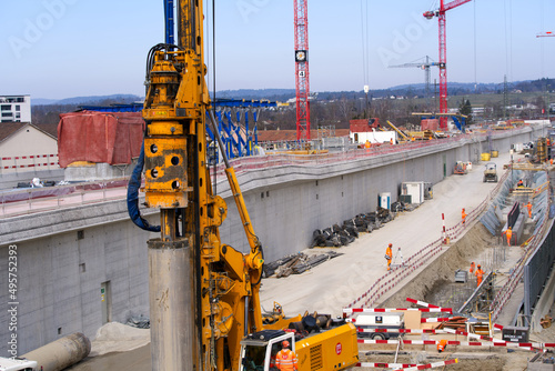 Highway enclosure construction site with heavy drilling machine at City of Zürich on a cloudy spring day. Photo taken March 11th, 2022, Zurich, Switzerland. photo