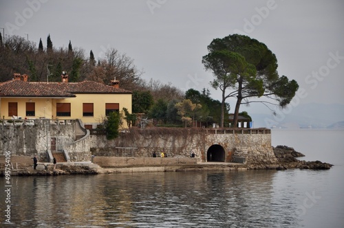 Calm sea and part of Croatian coast with house and pine tree on Adriatic Sea © Marilena