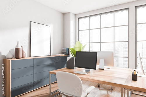 Light workplace interior with computer on table, window. Mockup frame