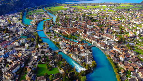 Fotografie Aerial view over the city of Interlaken in Switzerland - amazing drone footage