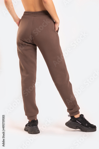 Grey pants on a girl in white background