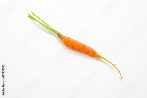 tiny orange carrot isolated on white background. tiny size. heathy and nutrition concepts. vitamin.