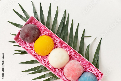 Obraz na plátně Japanese dessert wagashi in a gift open box of pink color lies on the surface on