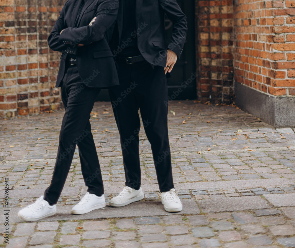 European Gay Couple wearing black suits, happy day of a same sex couple. Wedding photography. European Gay Couple wearing black suits, happy day of a same sex couple. Wedding photography.
