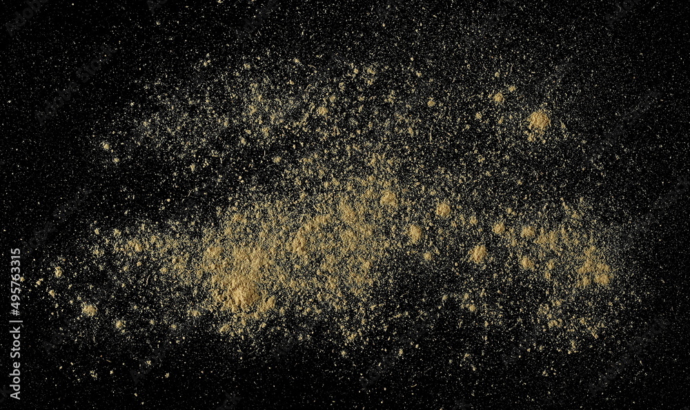 Ginger root powder isolated on black, top view Ginger root powder isolated on black, top view