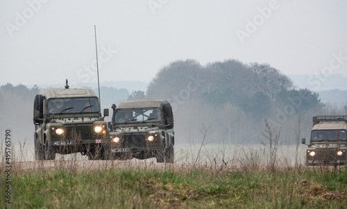 Valokuva a small convoy British Army Land Rover Defender Wolf medium utility vehicles in