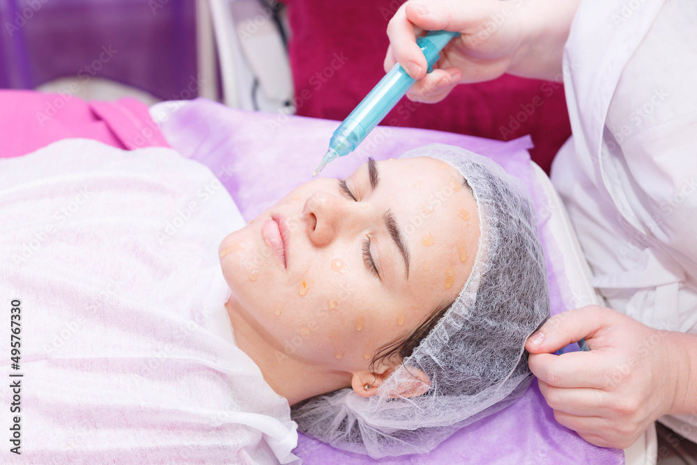 Beautiful girl with closed eyes on a procedure of carboxytherapy. Beautiful girl with closed eyes on a procedure of carboxytherapy.