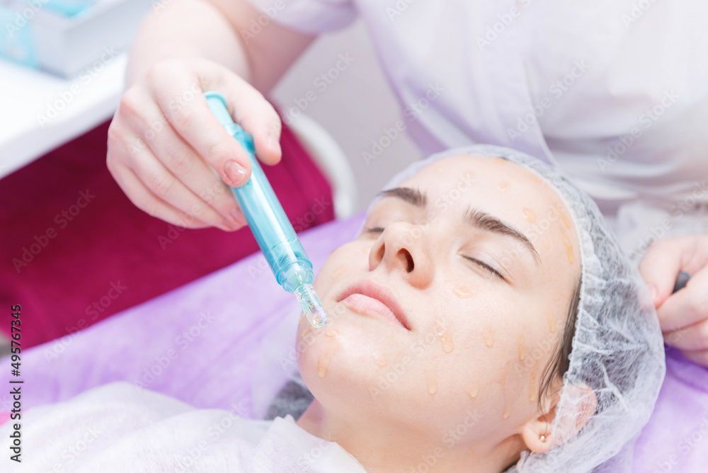 Beautiful girl with closed eyes on a procedure of carboxytherapy. Beautiful girl with closed eyes on a procedure of carboxytherapy.
