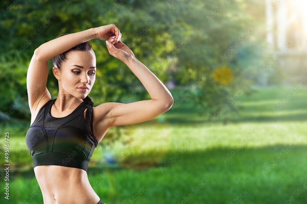 Healthy female athlete enjoy outdoor lifestyle sport training workout. Woman in sportswear and smartwatch stretching body. Healthy female athlete enjoy outdoor lifestyle sport training workout. Woman in sportswear and smartwatch stretching body.