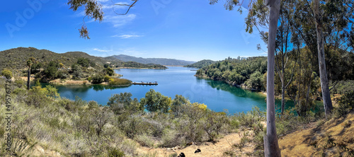 Dixon lake surrounded by green trees and bushes in background of greenery mountains in Escondido photo