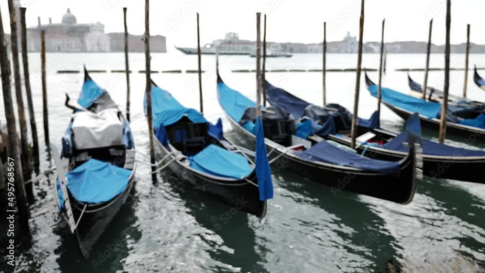 Venice, Italy - gondolas and gondoliers in the Grand Canal near the Rialto Bridge, in the San Marco Basin and between the canals of the lagoon city Venice, Italy - gondolas and gondoliers in the Grand Canal near the Rialto Bridge, in the San Marco Basin and between the canals of the lagoon city