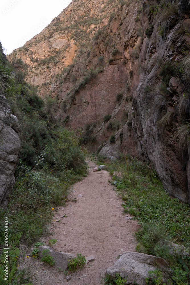Outdoor activity. View of the empty hiking path across the desert and canyon. Outdoor activity. View of the empty hiking path across the desert and canyon.