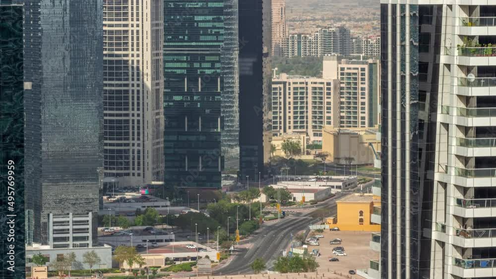 Tall residential buildings at JLT aerial timelapse, part of the Dubai multi commodities centre mixed-use district.