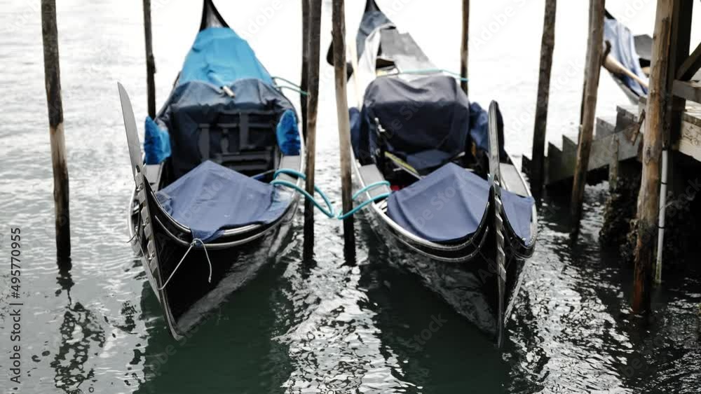 Venice, Italy - gondolas and gondoliers in the Grand Canal near the Rialto Bridge, in the San Marco Basin and between the canals of the lagoon city Venice, Italy - gondolas and gondoliers in the Grand Canal near the Rialto Bridge, in the San Marco Basin and between the canals of the lagoon city