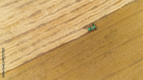 Aerial view combine harvester harvesting on the field