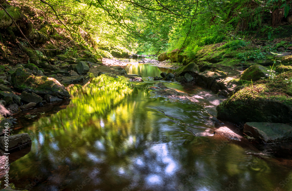 Dapled light on water, Maich water, Renfrewshire, Scotland, UK Dapled light on water, Maich water, Renfrewshire, Scotland, UK