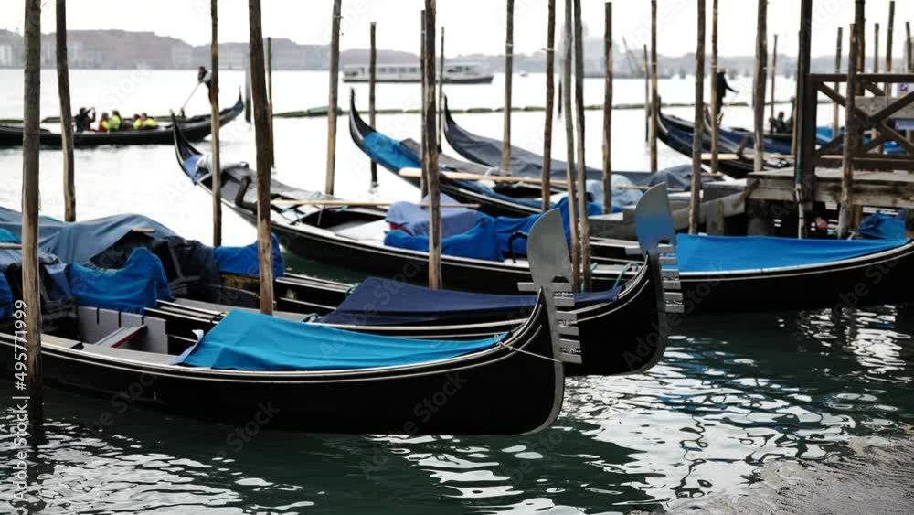 Venice, Italy - gondolas and gondoliers in the Grand Canal near the Rialto Bridge, in the San Marco Basin and between the canals of the lagoon city Venice, Italy - gondolas and gondoliers in the Grand Canal near the Rialto Bridge, in the San Marco Basin and between the canals of the lagoon city