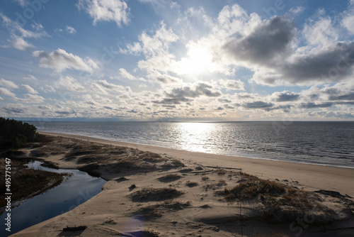 Fototapeta Naklejka Na Ścianę i Meble -  the beach and the blue water of the Baltic Sea and the sky is bluespring. Latvia.