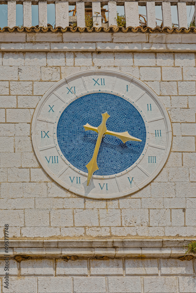 Blue clock at old stone house in Cres Croatia