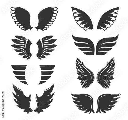 Set of hand drawn bird or angel wings of different shape in open position. Contoured doodle