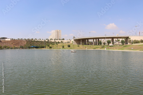 Beautiful view of pond water in the Anaba Park in Modi'in-Maccabim-Re'ut, Israel with a blue sky photo