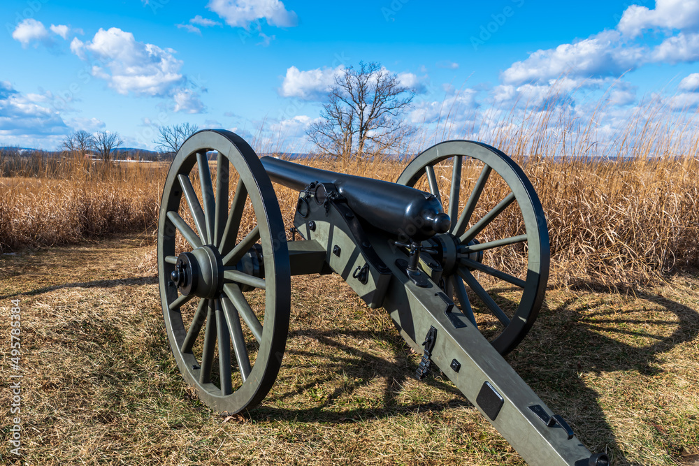 A civil war cannon on the battlefield in the Gettysburg National Military Park on a sunny spring day