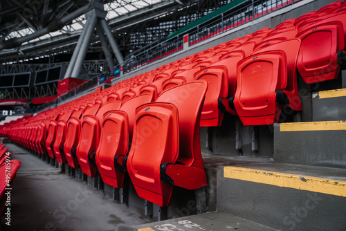 Rows of seats in a football stadium. Bright red stadium seats