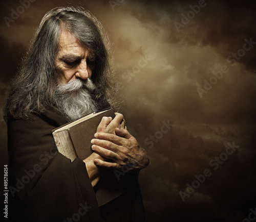 Fotografie, Obraz Praying Monk with Bible