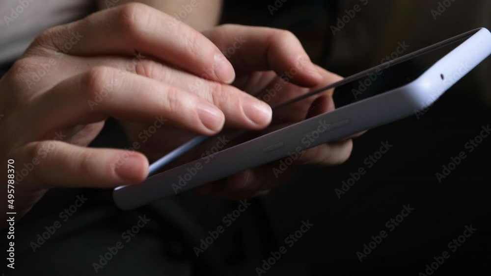 Woman hand holding cell phone touch screen typing scroll page using app ...