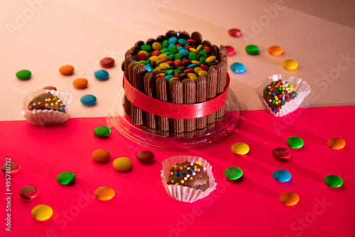chocolate cake with icing and sprinkles