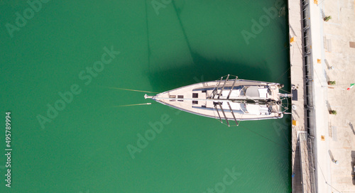 Aerial drone photo of a sail boat in the ope sea