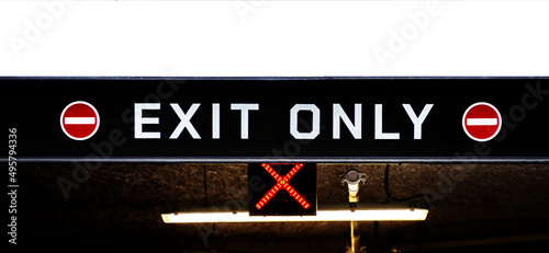 Black and red sign shows where the exit is, copy space photo