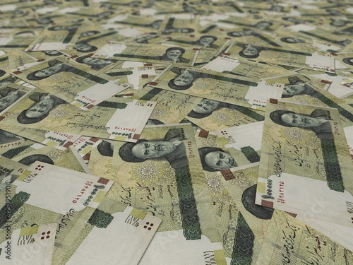 Dozens of iranian paper money on the gorund photo