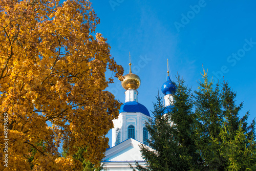 Two domes of the church with the cross with blue sky on the background in Tambov, Russia photo