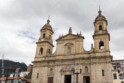 Closeup of the Primatial Cathedral against a cloudy sky in Bolivar Square, Bogota photo