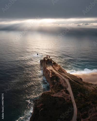 Vertical shot of the Nazare lighthouse on the west coast of Portugal photo