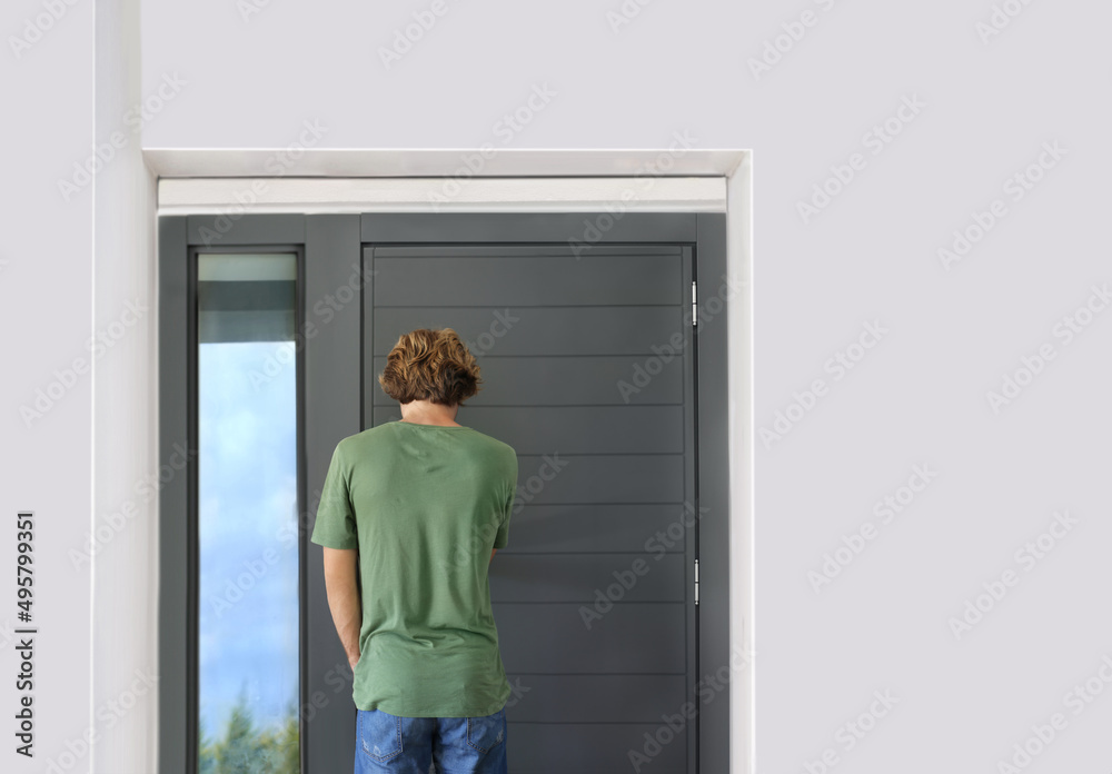Man opening the door of her home.Inviting the guests. Man opening the door of her home.Inviting the guests.