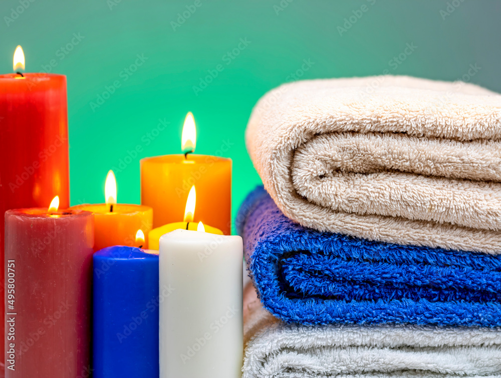 Towels bent on top of each other with candles around Towels bent on top of each other with candles around