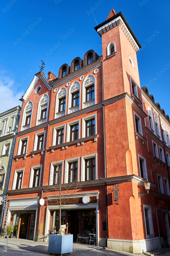 Obraz premium facade of historic tenement house with tower in the city of Poznan